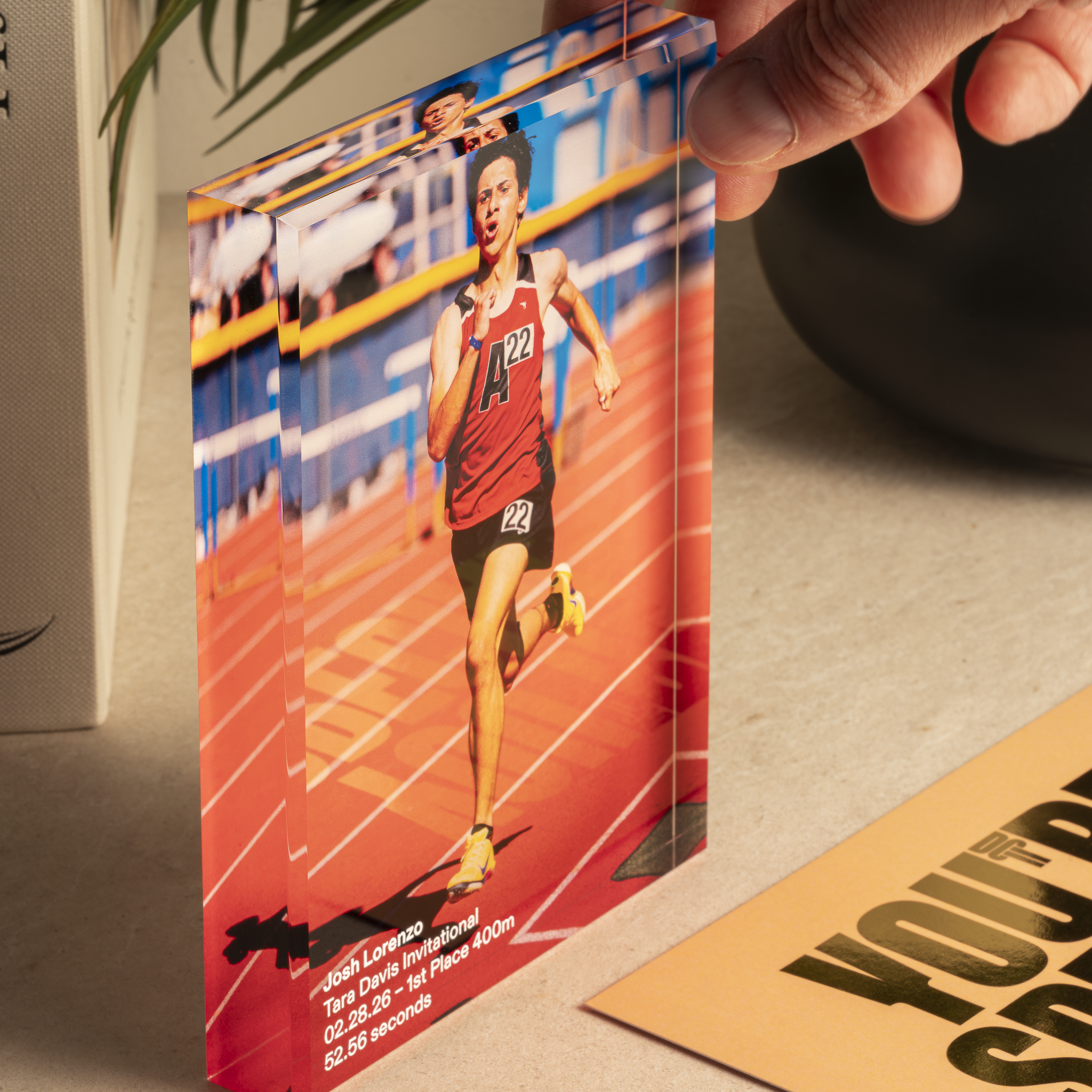 a person holding a picture of a runner