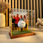 a group of men in a glass case with a golf ball